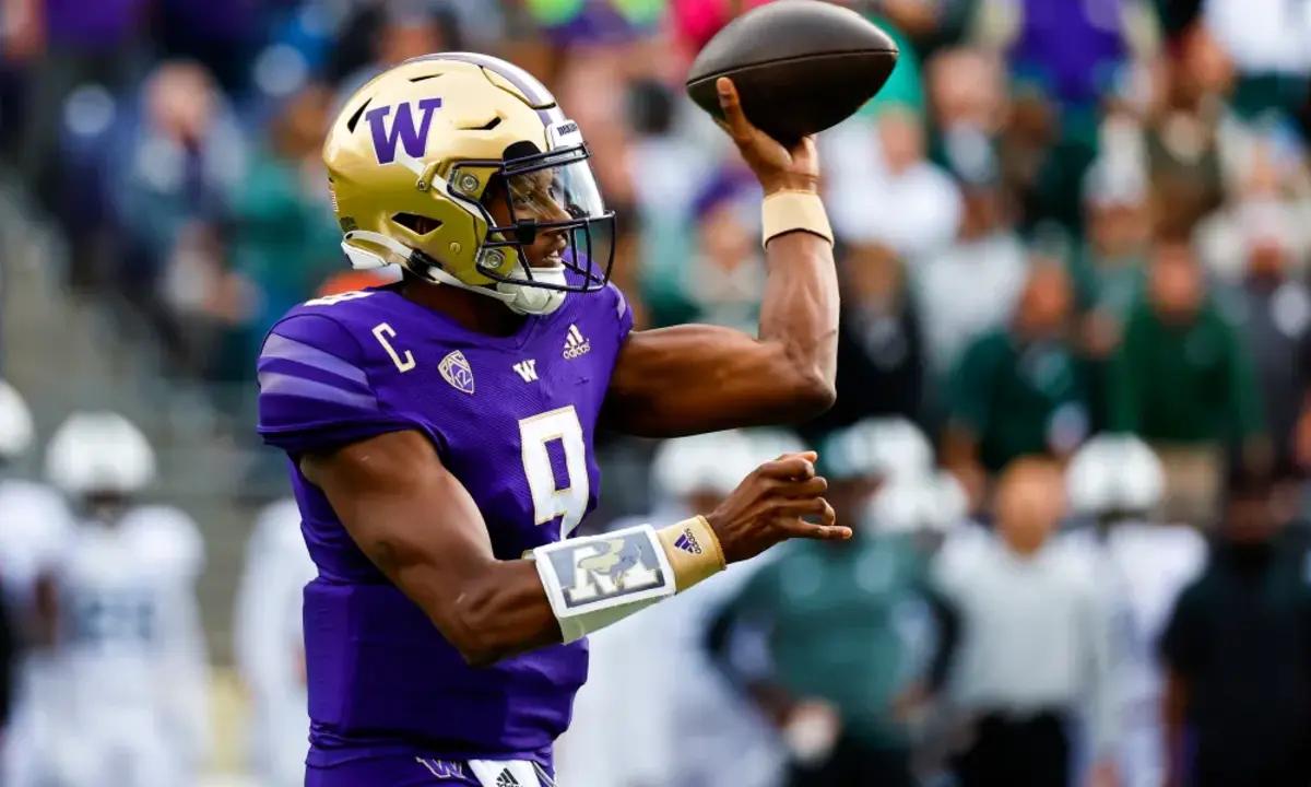 Washington QB Michael Penix Jr. attempts a pass against Michigan State.